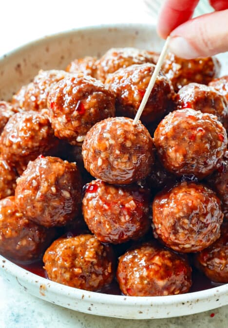 serving meatballs with grape jelly as an appetizer with toothpicks