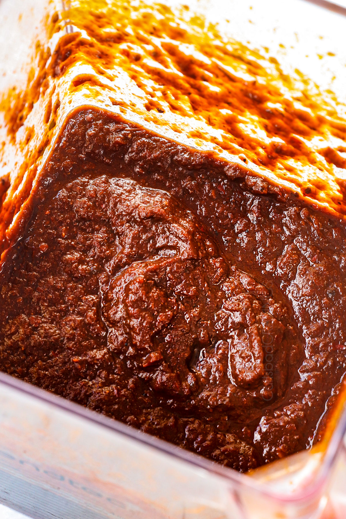 showing how to make Chicken Mole recipe by blending the ingredients until smooth