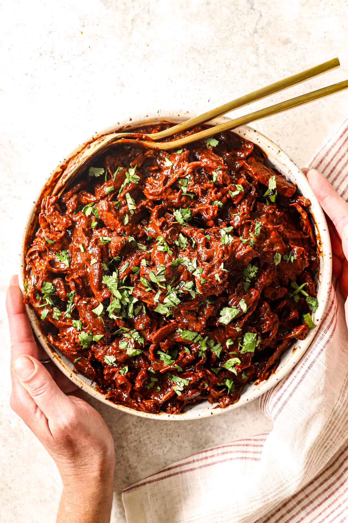 top view of chicken mole in a bowl garnished with cilantro showing how saucy it is