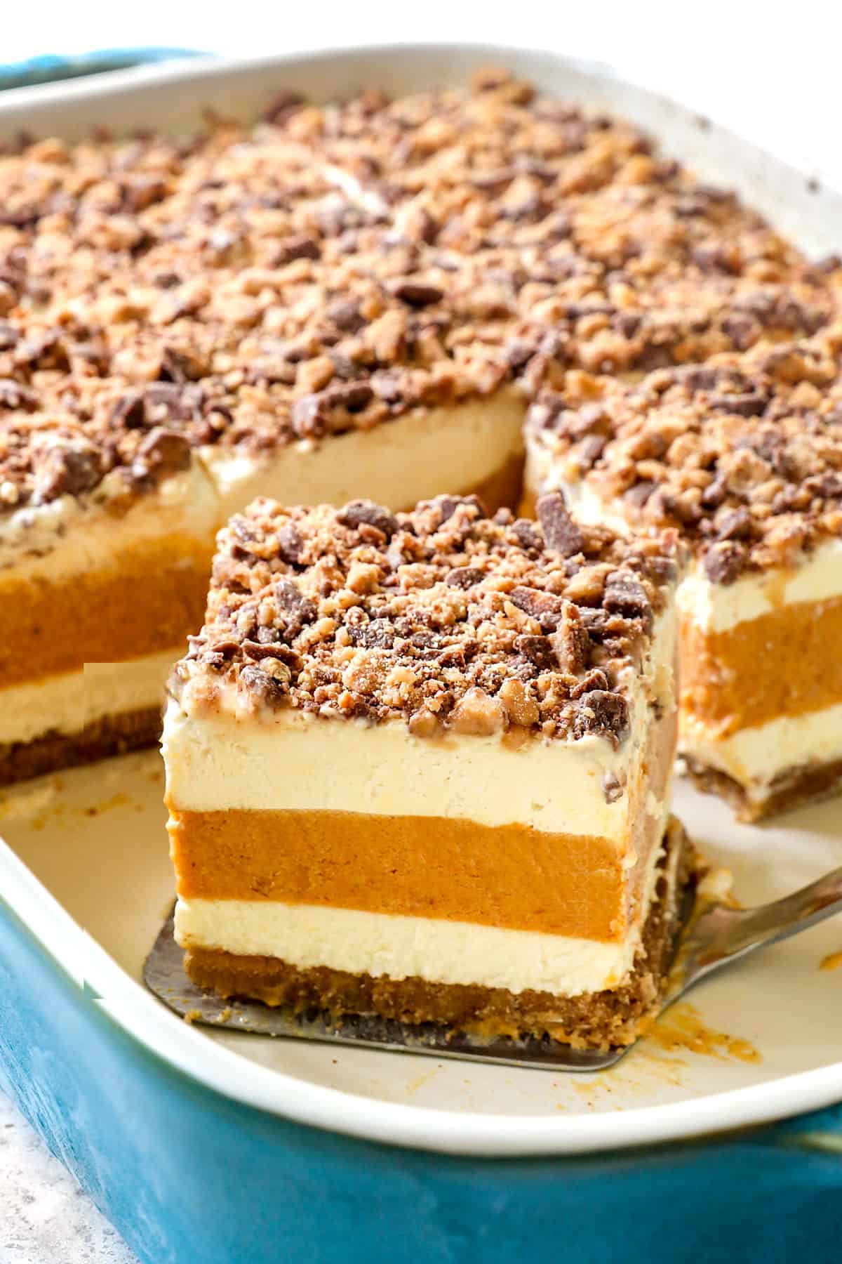 serving a slice of pumpkin delight showing the different layers