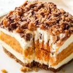 a slice of pumpkin delight (pumpkin lush) with a bite taken out