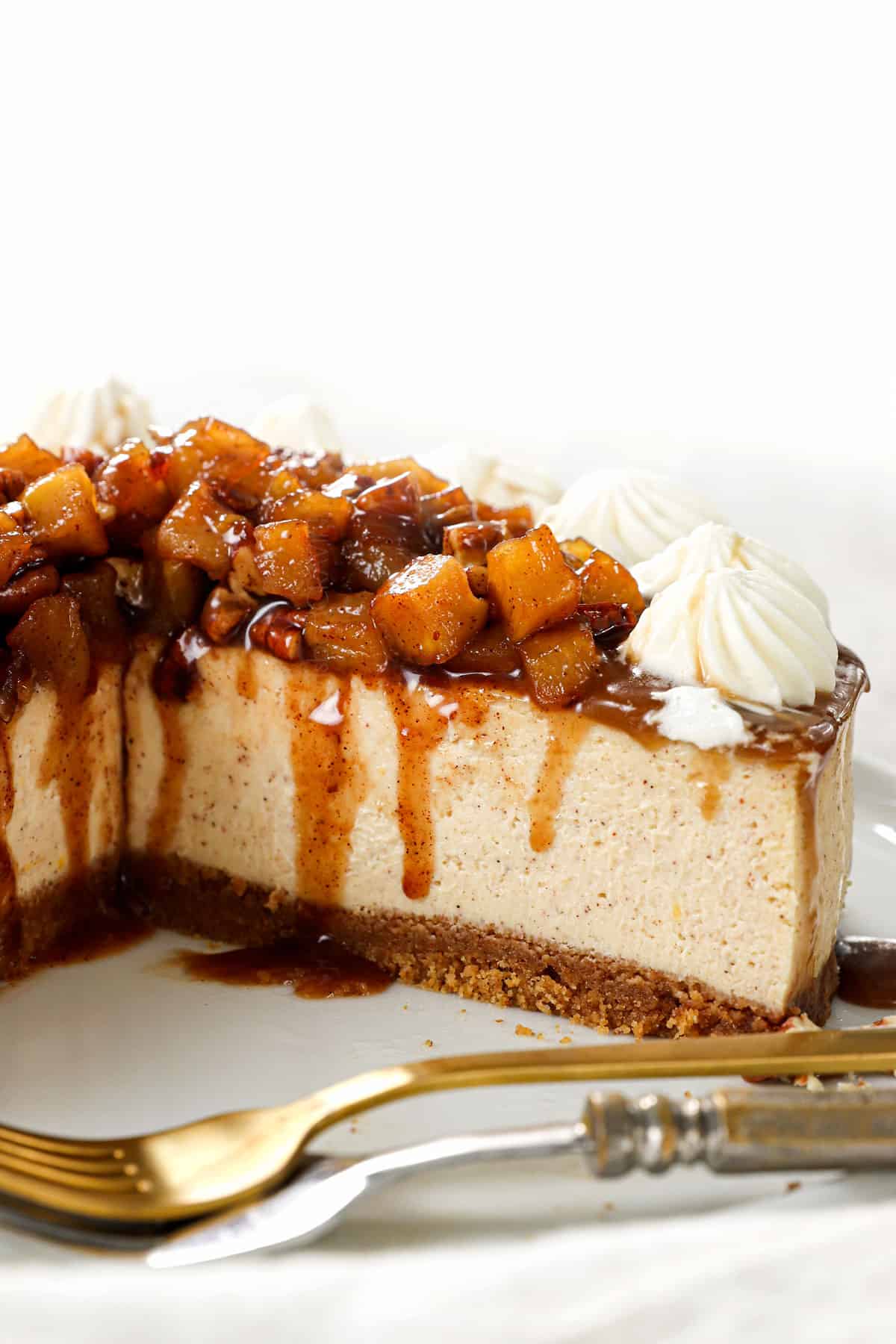 caramel apple cheesecake with slices taken out showing how creamy it is