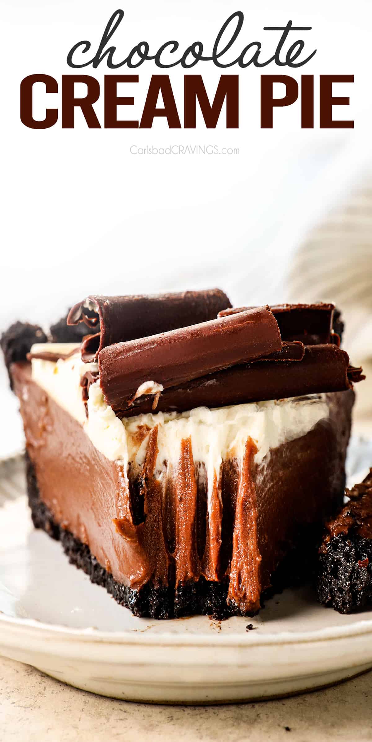 up close view of chocolate cream pie recipe with a bite taken out showing how creamy it is