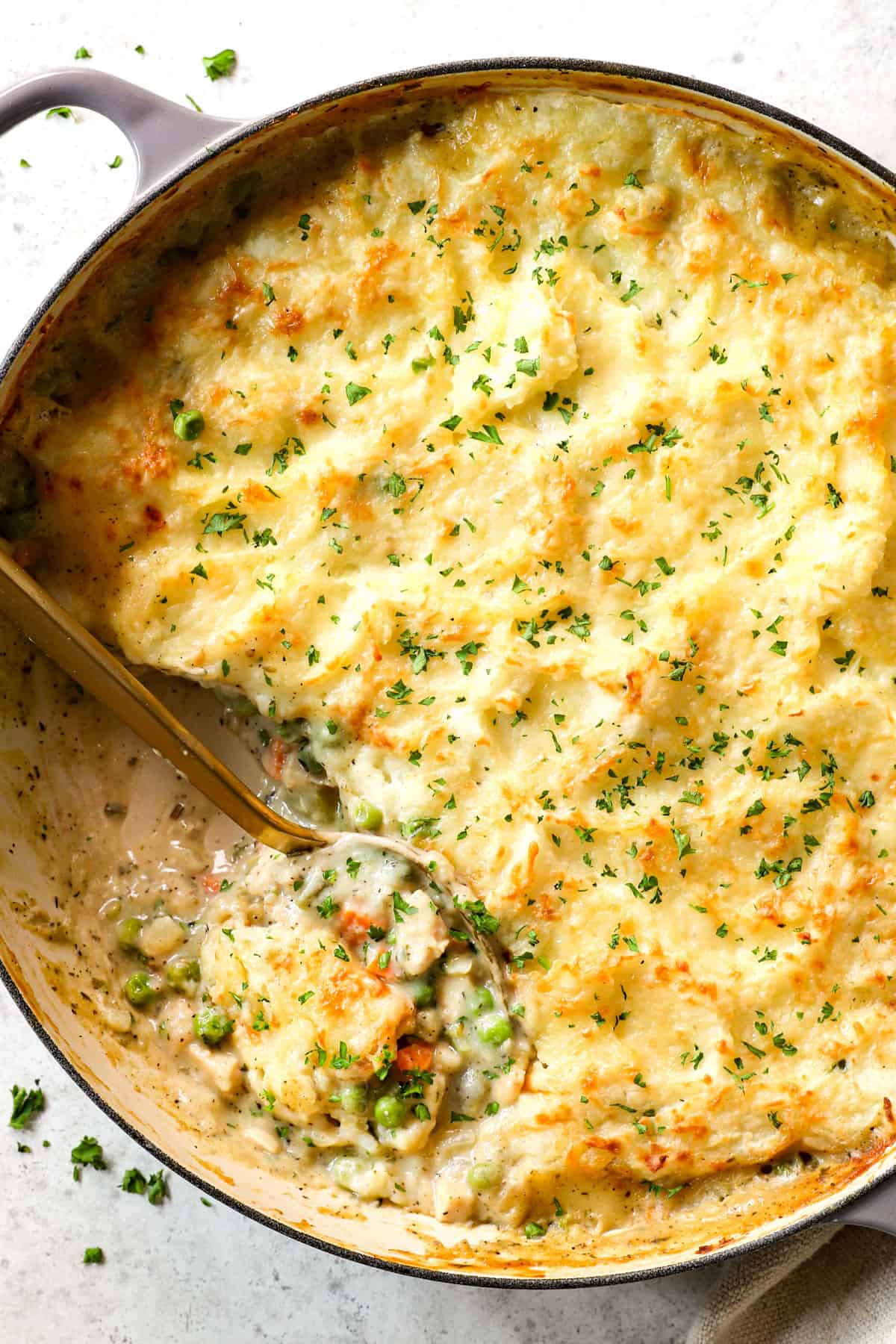 showing how to make turkey shepherd's pie recipe by baking until golden