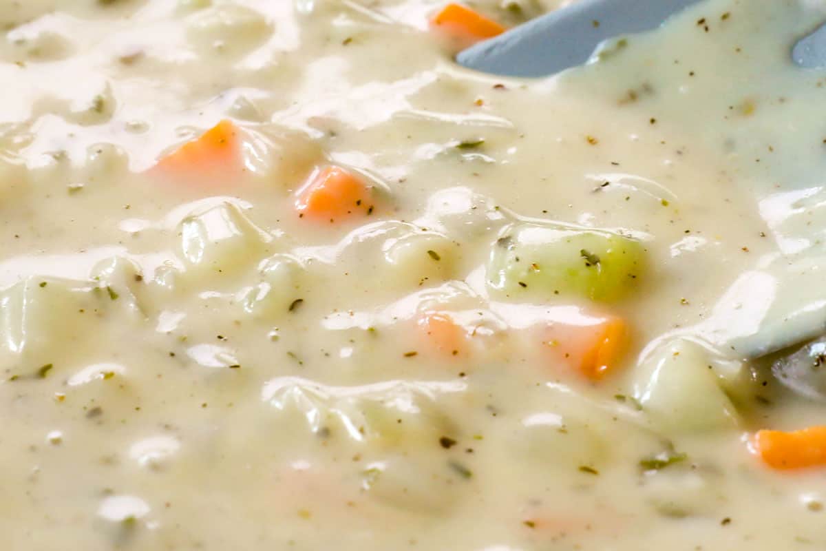 showing how to make turkey shepherd's pie recipe simmering the filling until thickened