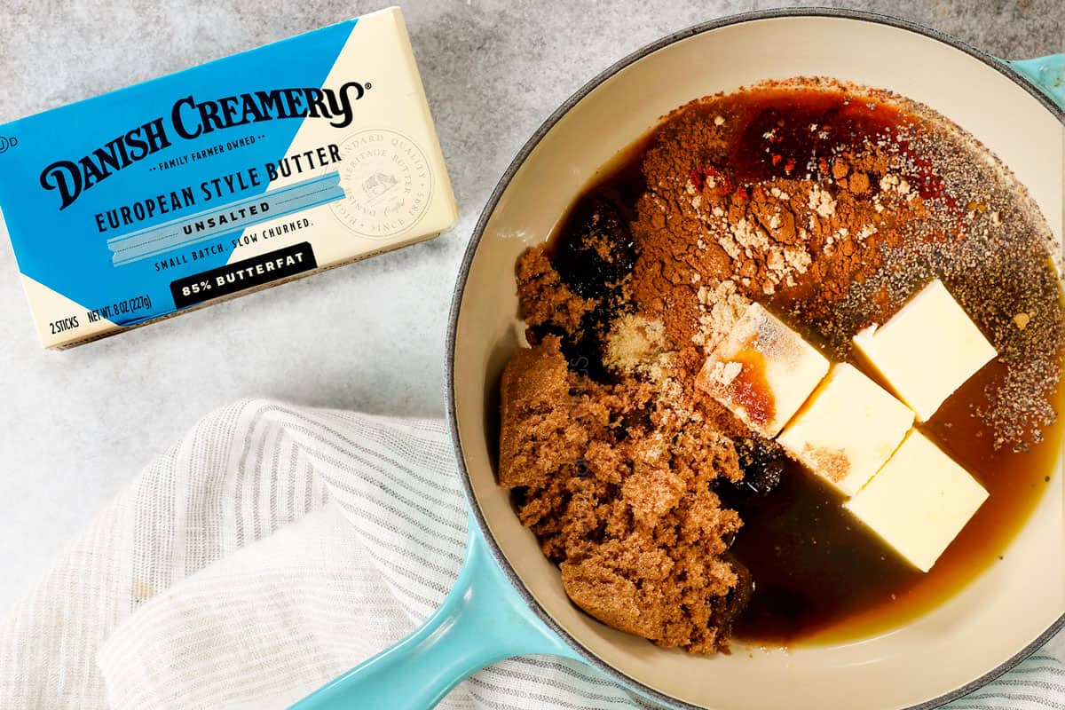top view showing ingredients for candied yams (candied sweet potatoes): sweet potatoes, butter, brown sugar, maple syrup and spices