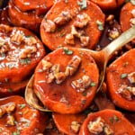 up close of serving candied yams (candied sweet potatoes) showing how tender and caramelize they are