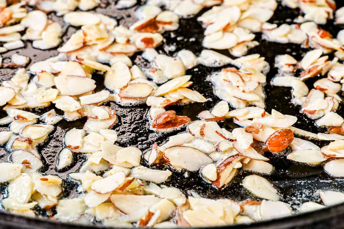 showing how to make Green Beans Almondine by sautéing the almonds in butter to toast
