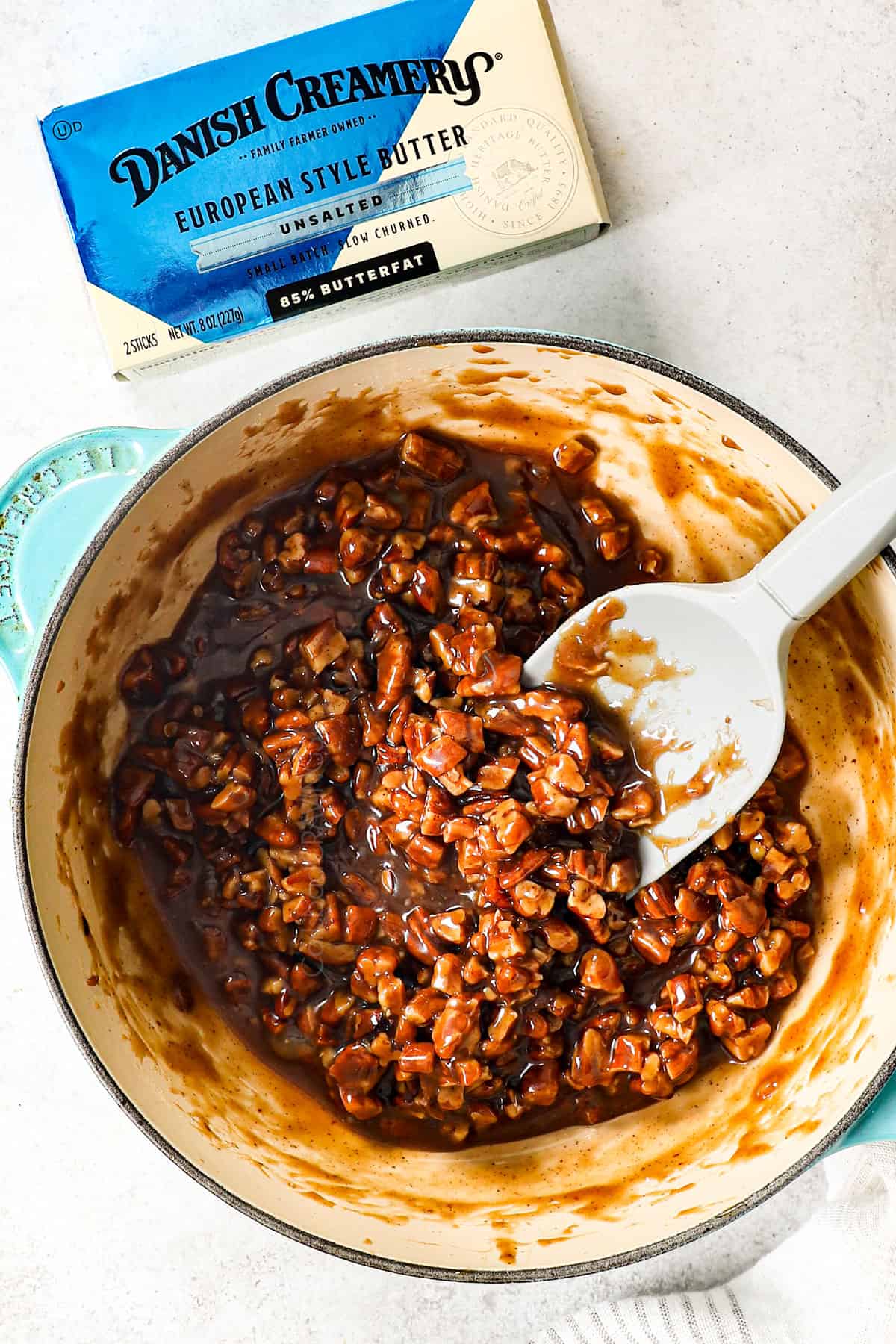 showing how to make pecan pie cookies by simmering pecans with sugar, butter and corn syrup