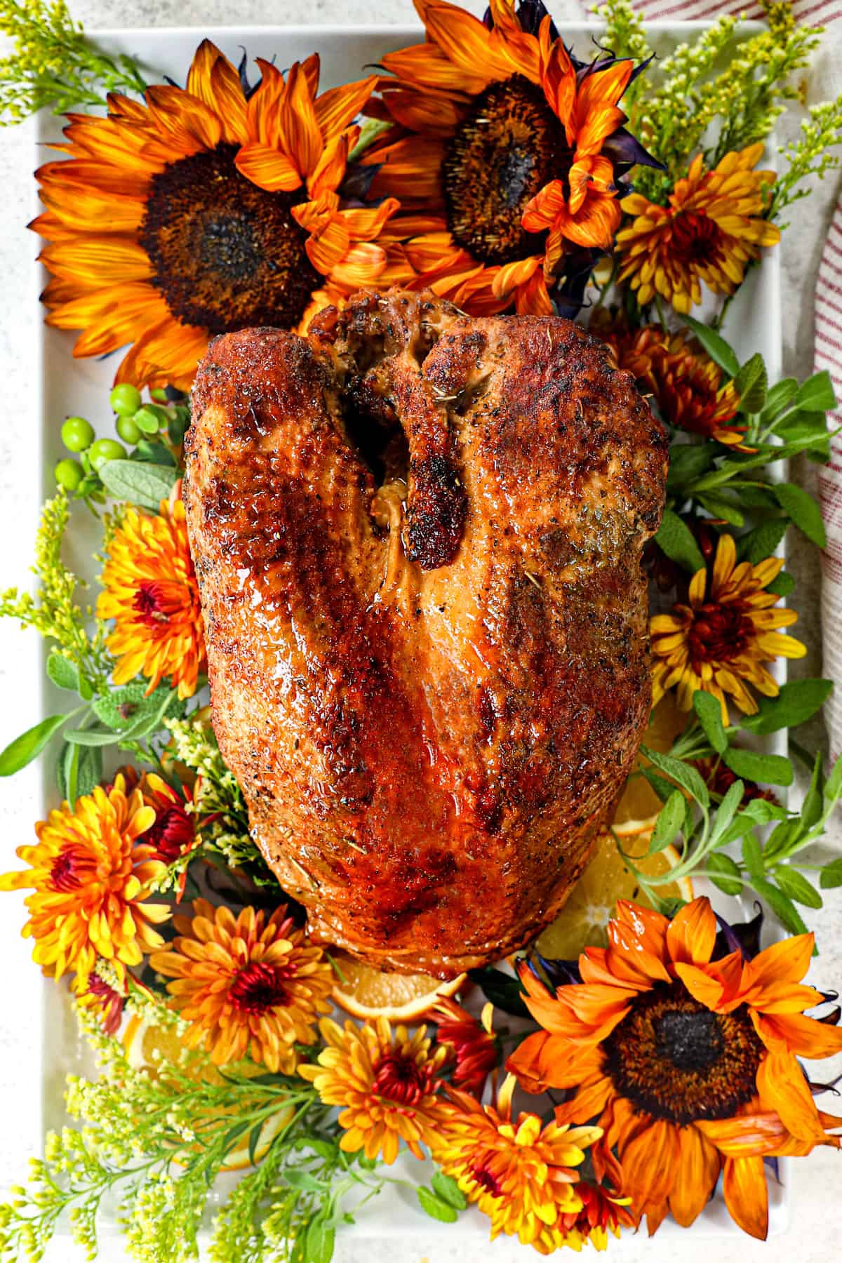top view of roasted turkey breast on a platter showing how crispy the skin is