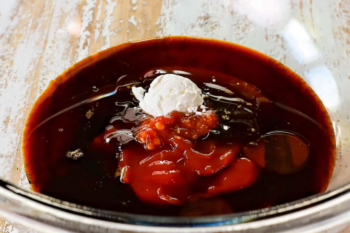 showing how to make Asian meatballs by whisking together the meatball sauce