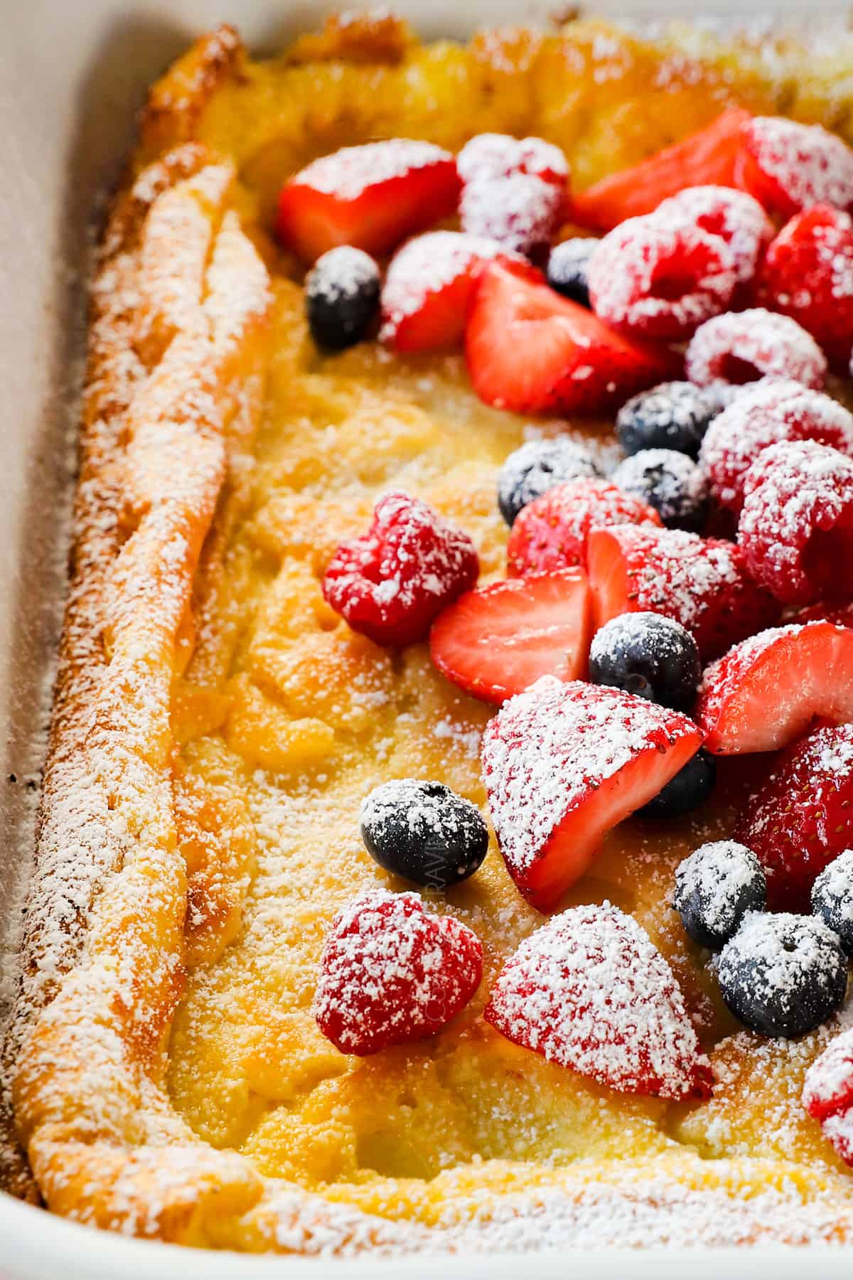 German pancake recipe in a cast iron skillet with berries