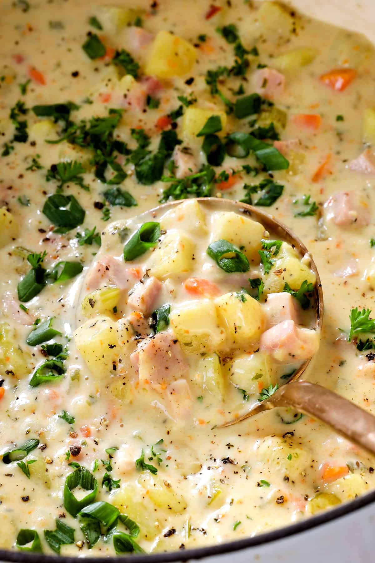 showing how to make ham and potato soup recipe by stirring to combine