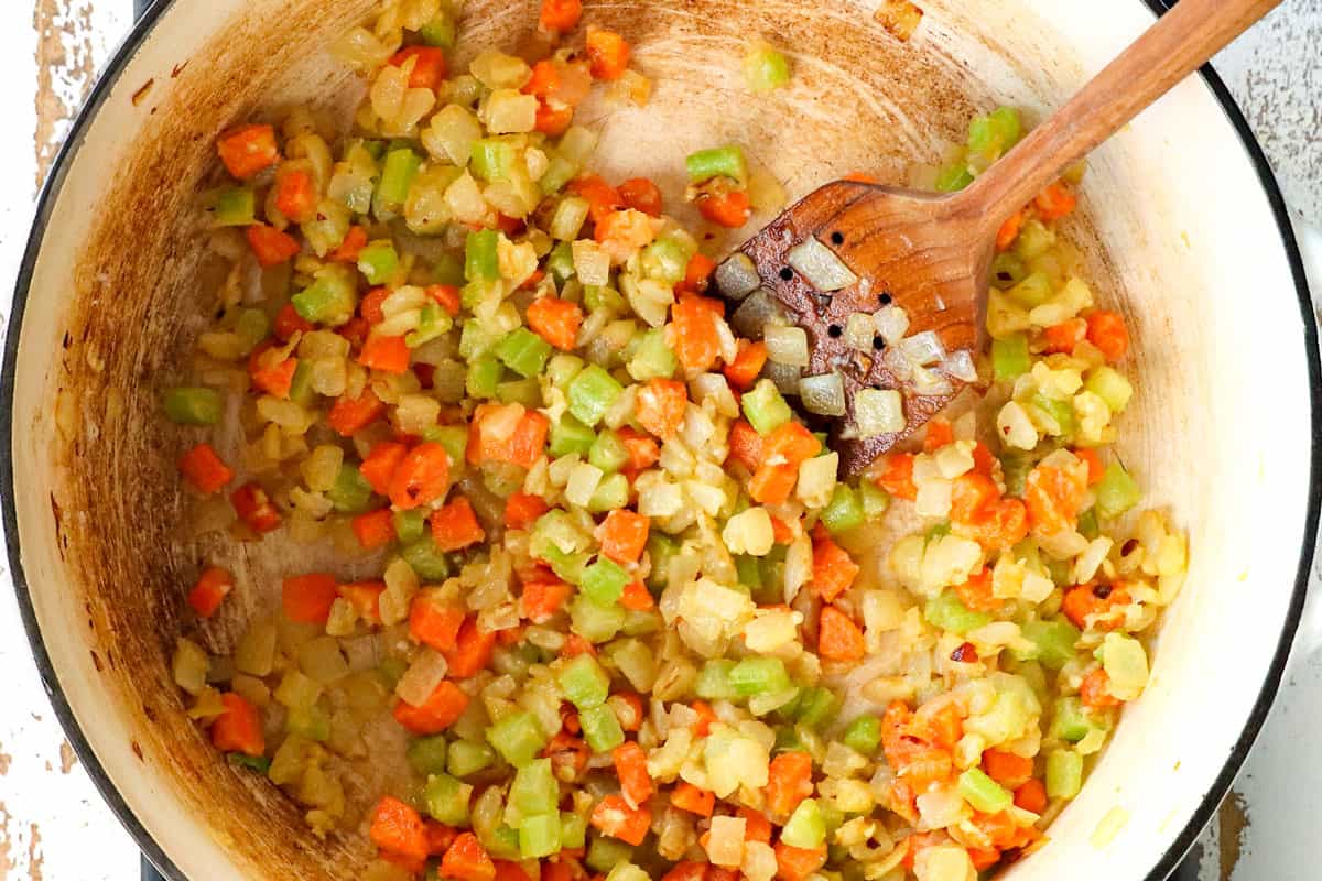 showing how to make Ham and Potato Soup by making a roux by adding flour to the vegetables