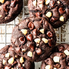 up close top view showing how to make macadamia nut cookies by cooling on a wire rack