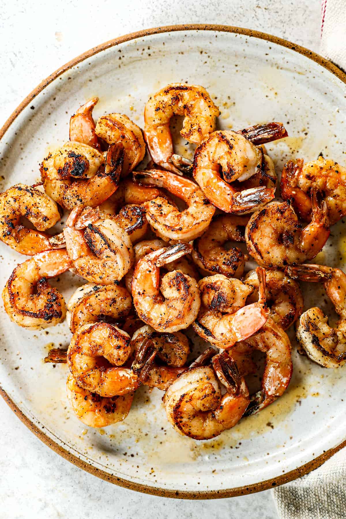 showing how to make shrimp risotto by searing the shrimp in a pan