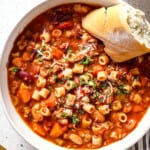 top view of pasta fagioli (pasta fazool) garnished with fresh parsley