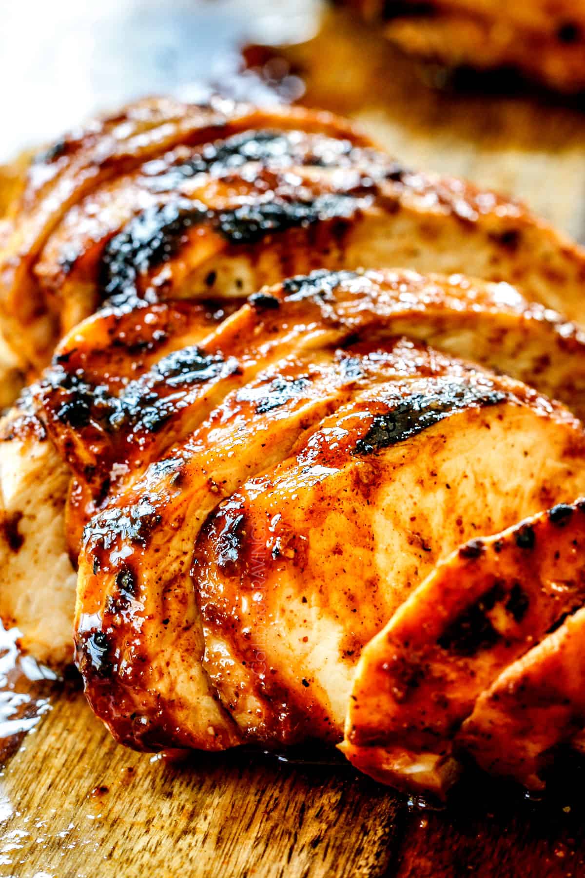 showing how to make buffalo chicken by slicing the chicken into thin slices