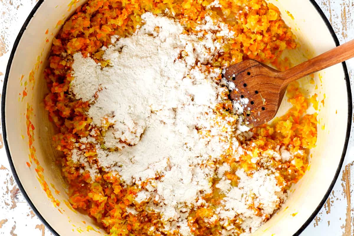 showing how to make creamy tomato tortellini soup recipe by sautéing the vegetables, then adding the flour
