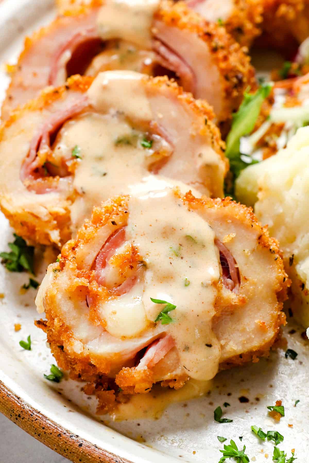serving chicken cordon bleu with chicken cordon bleu sauce