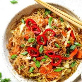 serving pad woon sen in a bowl with chopsticks
