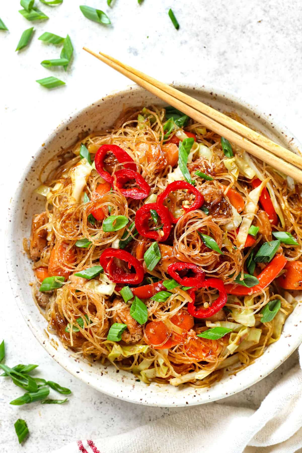 serving pad woon sen in a bowl with chopsticks