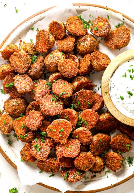 top view of serving crispy Parmesan Crusted potatoes with herb sauce