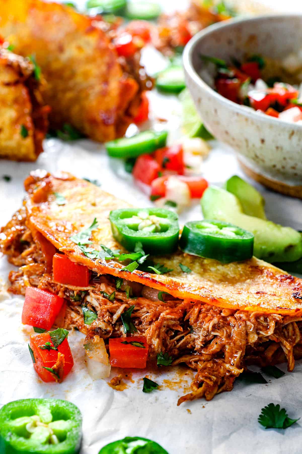 up close of baked chicken tacos with a crispy tortilla