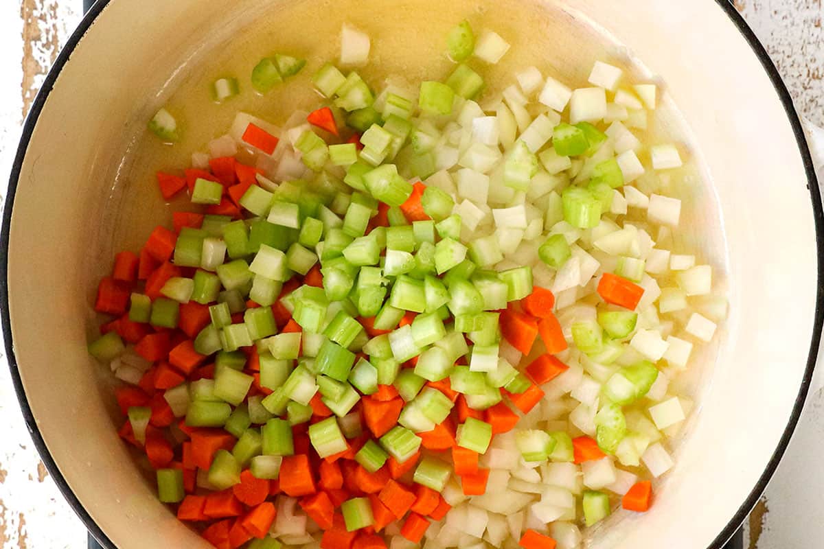 a collage showing how to make chicken and wild rice casserole by sautéing onions, carrots and celery in a Dutch oven until the onions are tender