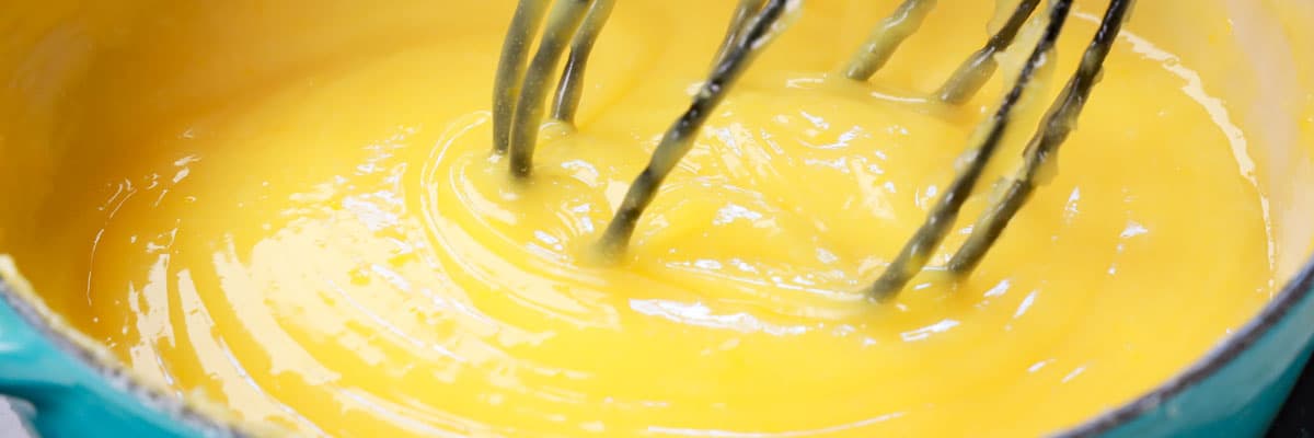 showing how to make easy Lemon Meringue Pie by cooking the filling until it is thick