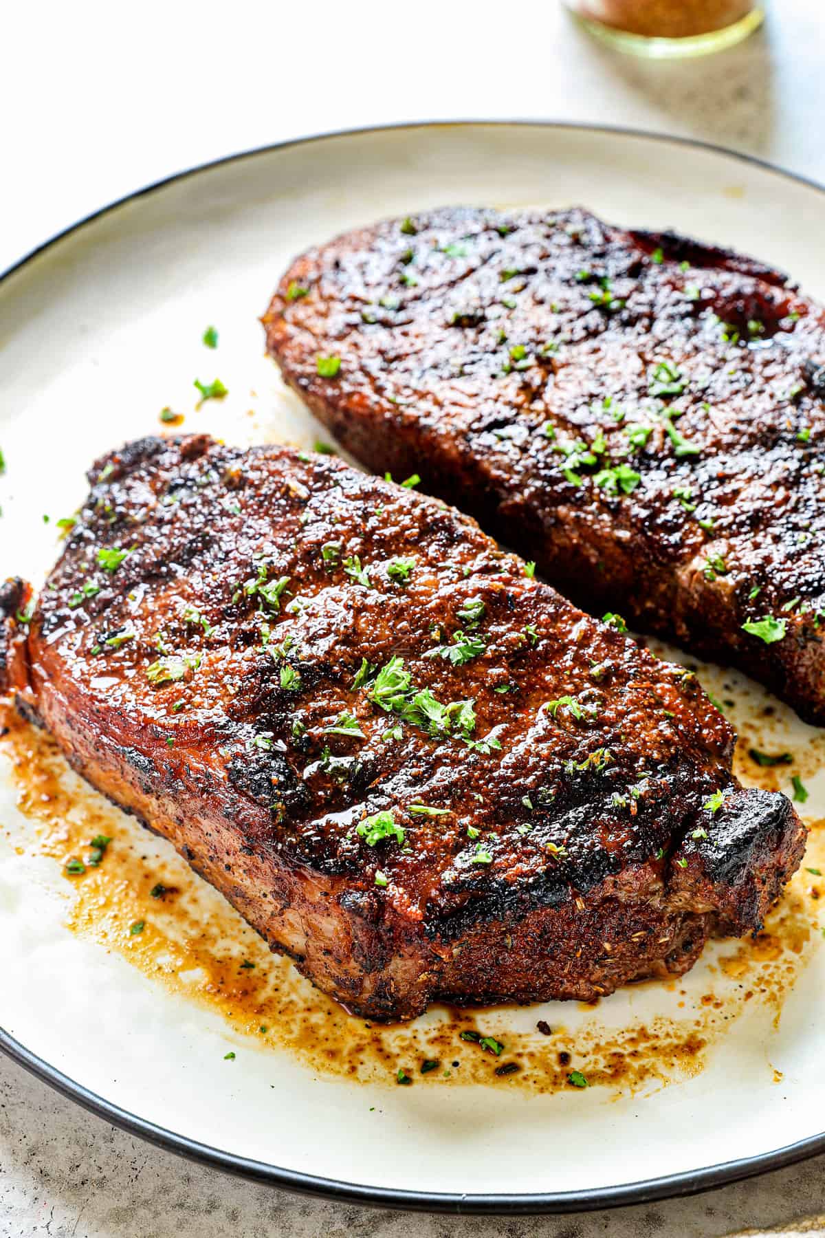 showing how to use steak seasoning recipe by grilling steak with the steak spice rub until golden on the outside