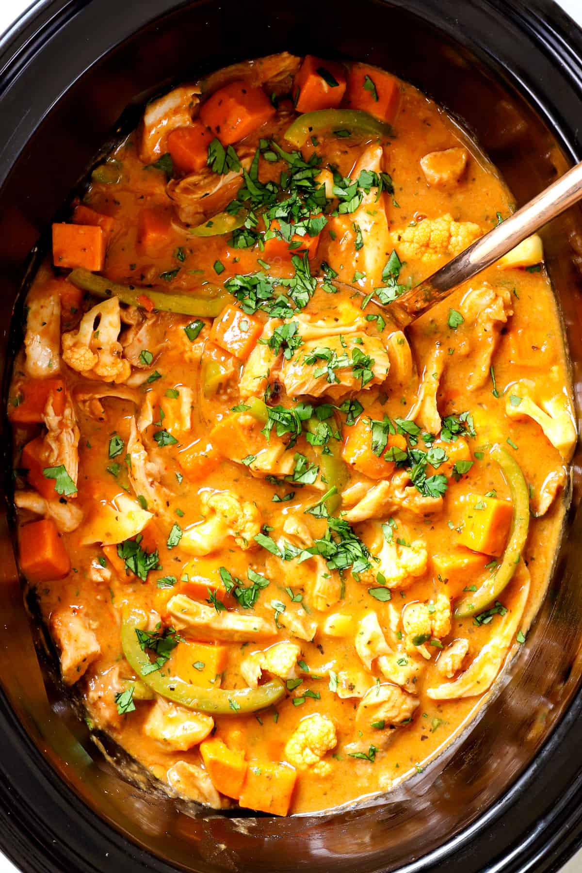 showing how to make crockpot Thai curry chicken by adjusting to taste with lime juice, chili sauce or fish sauce