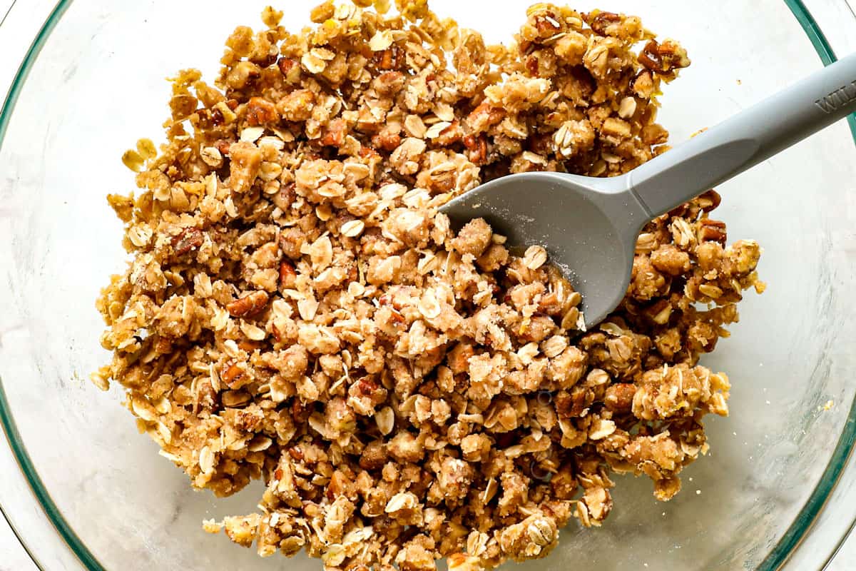 showing how to make cherry crisp recipe by combining the crisp topping ingredients together in a glass bowl