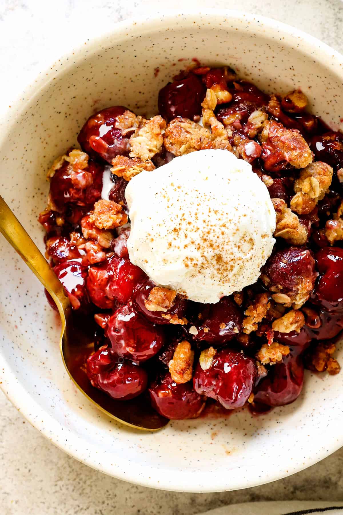 top view of old fashioned cherry crisp fresh cherries in a bowl