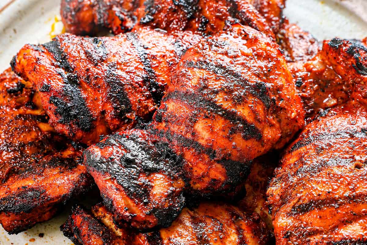 showing how to make chicken street tacos by grilling the chicken until charred in spots and cooked through