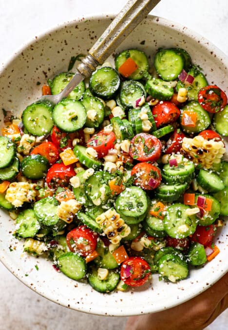 top view serving cucumber salad on a plate with vinegar dressing