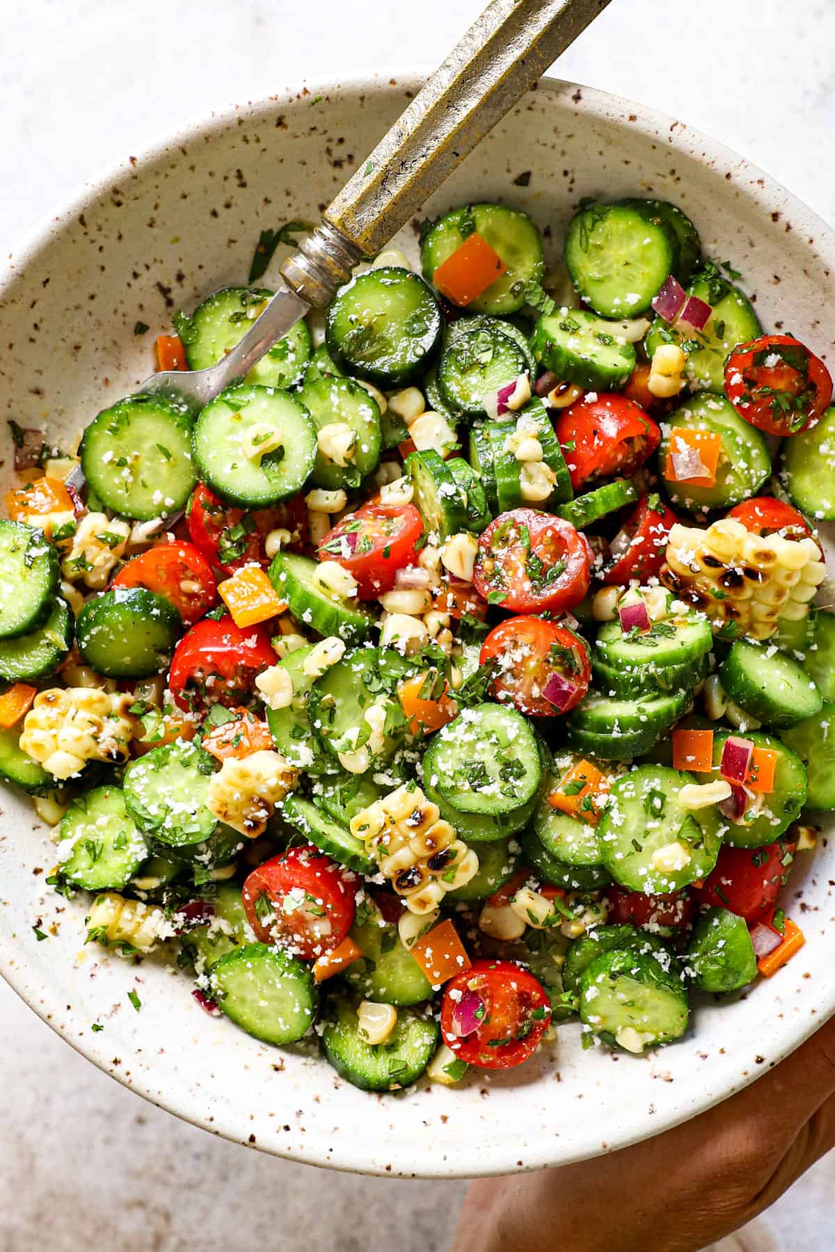 top view serving cucumber salad on a plate with vinegar dressing