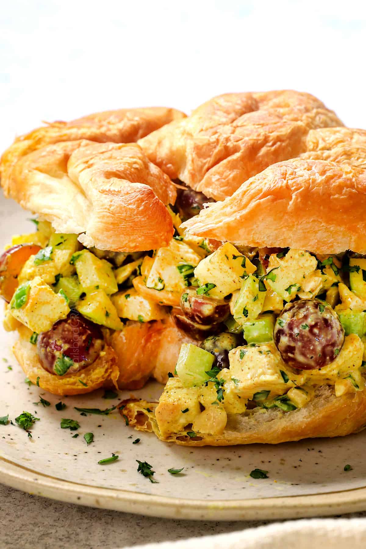 showing how to serve curry chicken salad as a sandwich