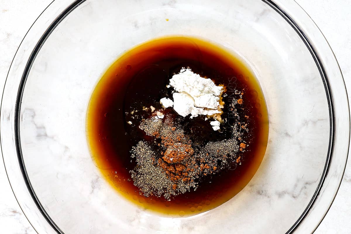showing how to make chow mein by whisking the stir fry ingredients together in a bowl