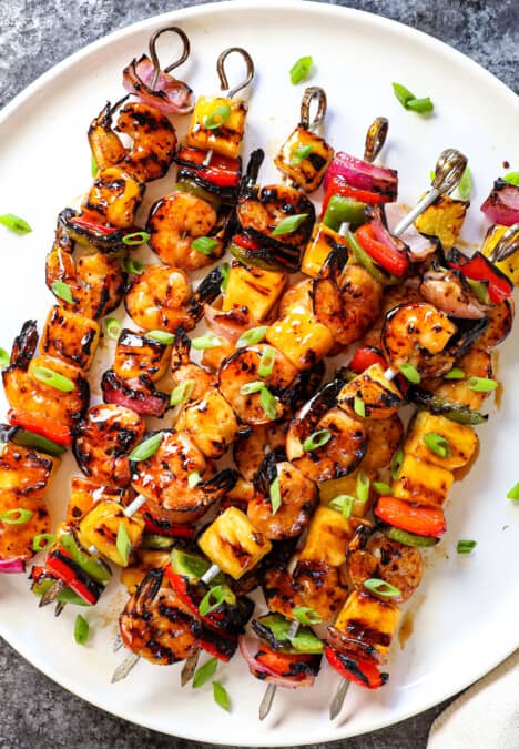 top view of serving shrimp kabobs on a white plate