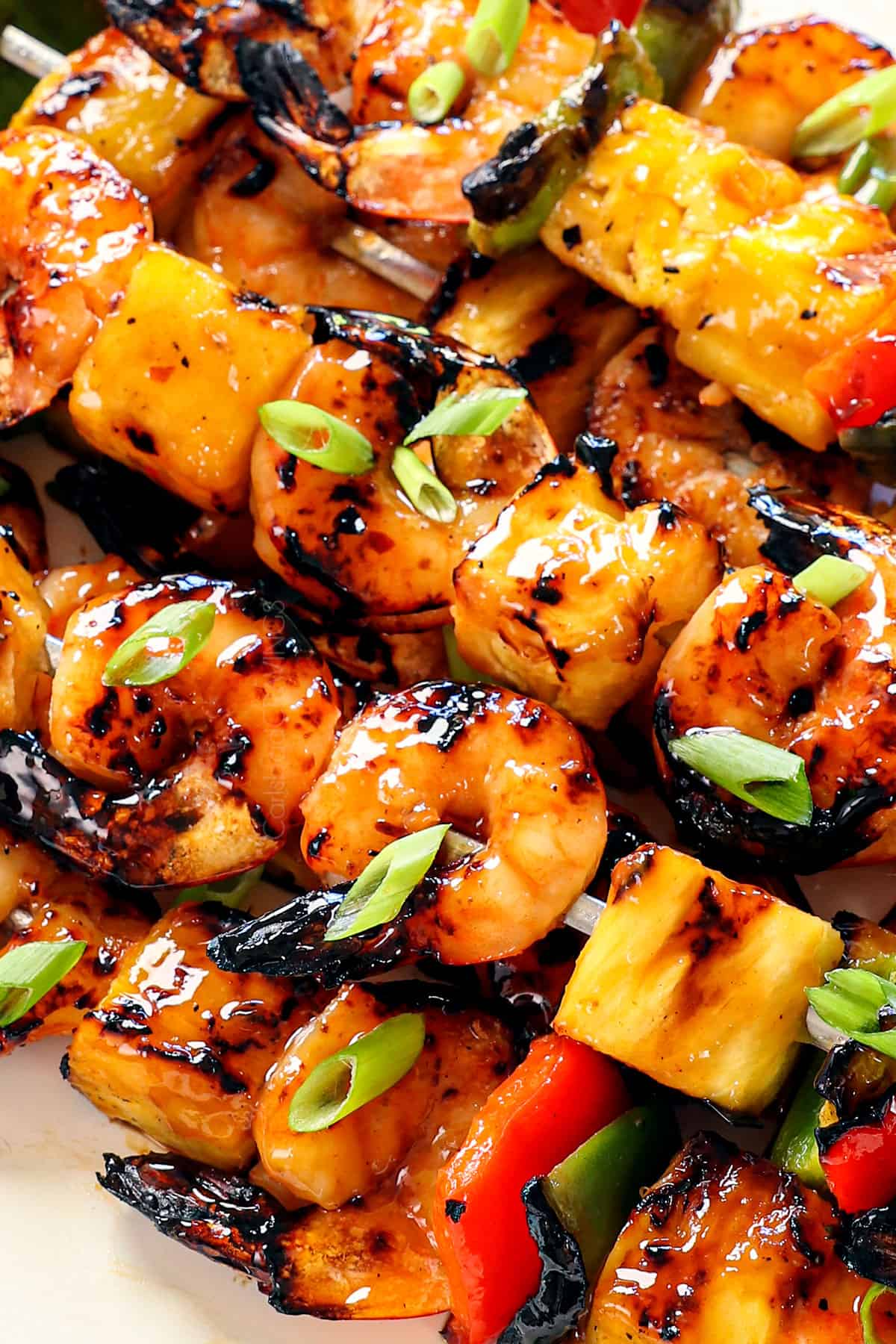 up close of shrimp skewers showing how juicy the shrimp is and the pineapple carmelized