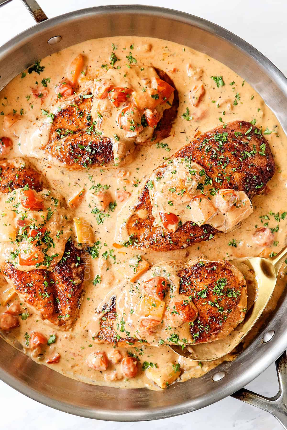 showing how to use Cajun seasoning on chicken