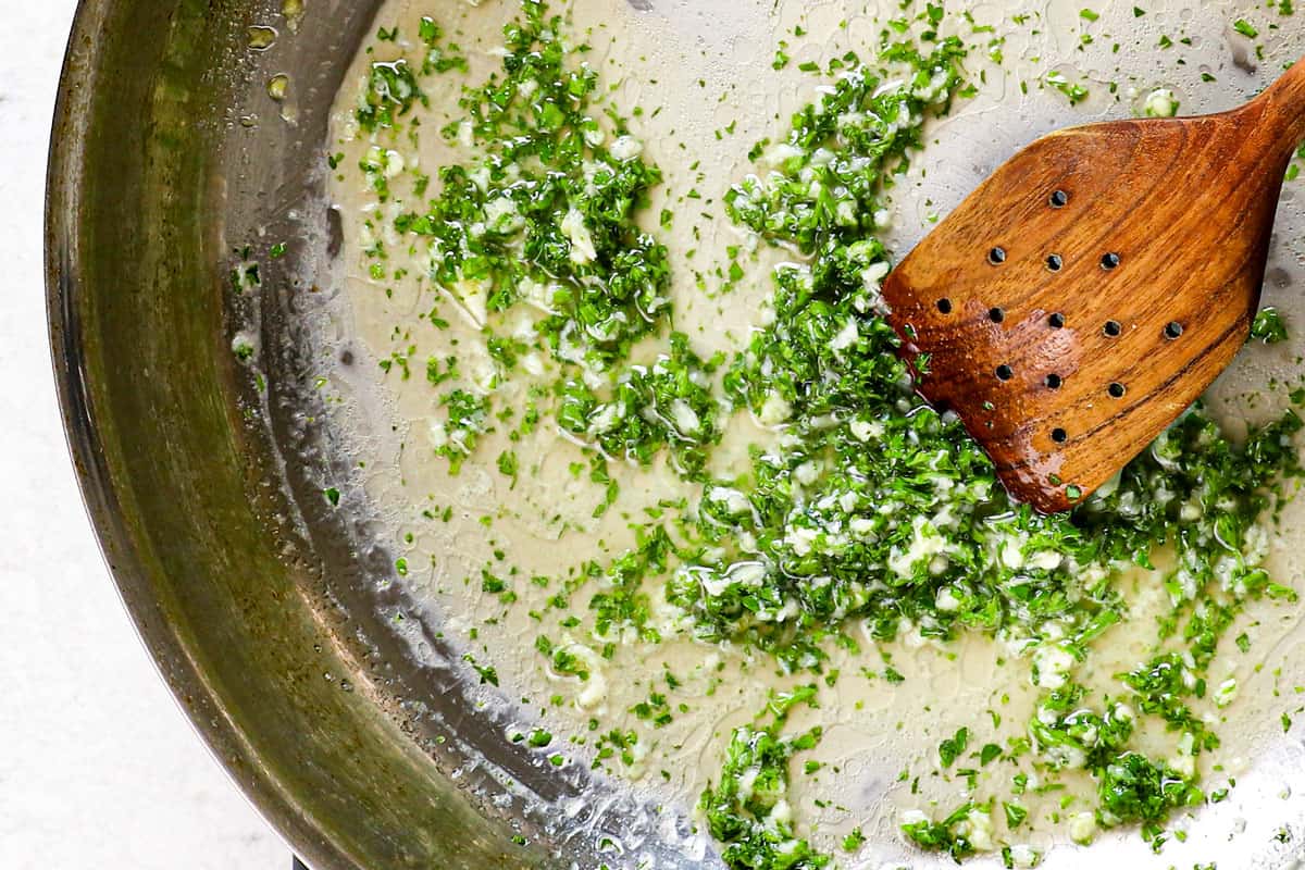 showing how to make Cajun shrimp recipe by sautéing garlic in butter, then adding parsley and lemon juice