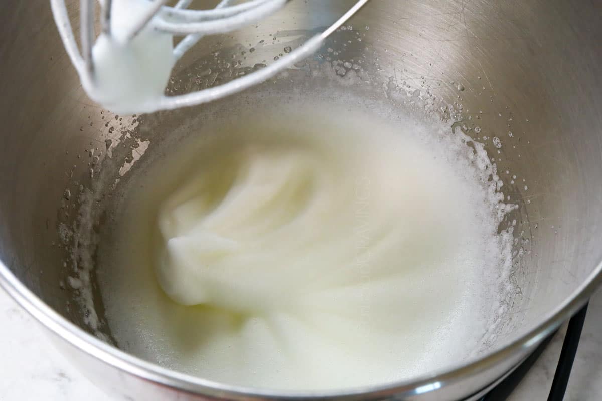 showing how to make pumpkin waffles recipe by whipping egg whites to stiff peaks