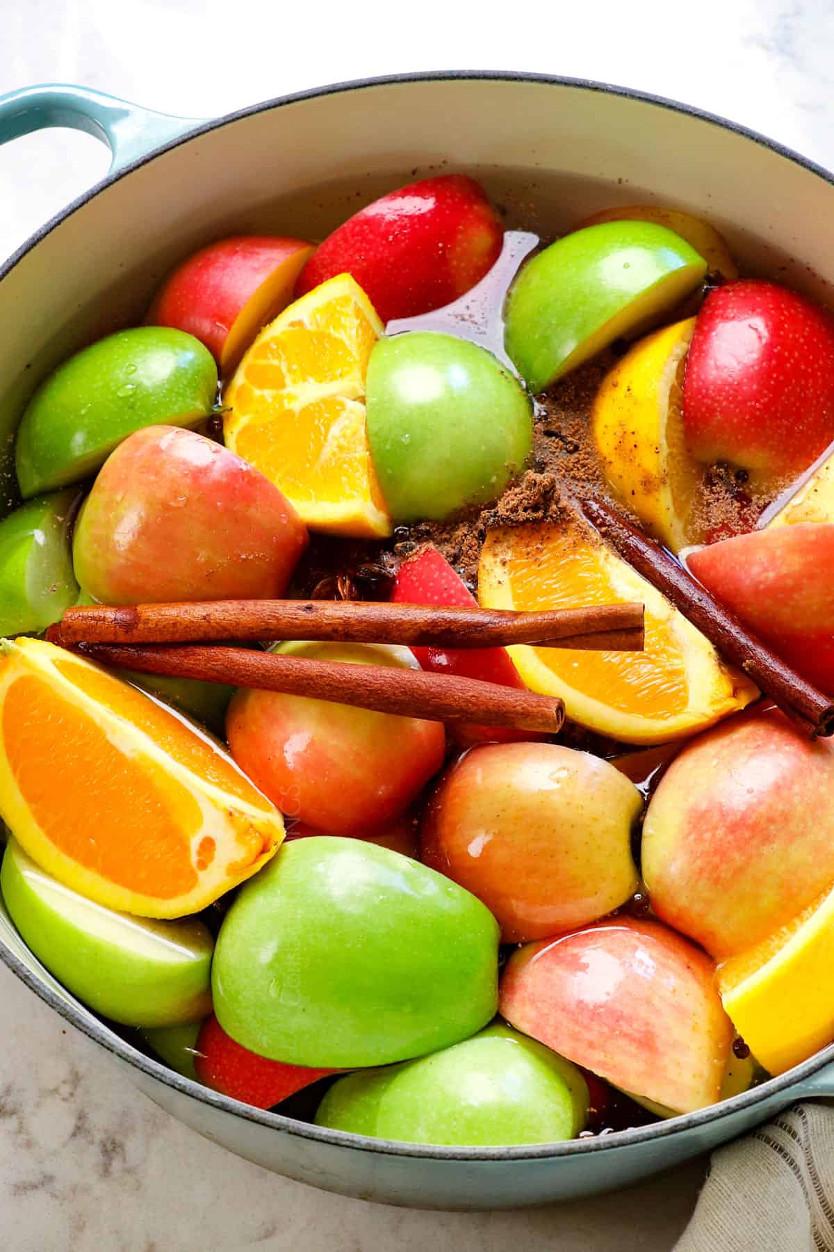 apples simmering in a pot to make apple cider