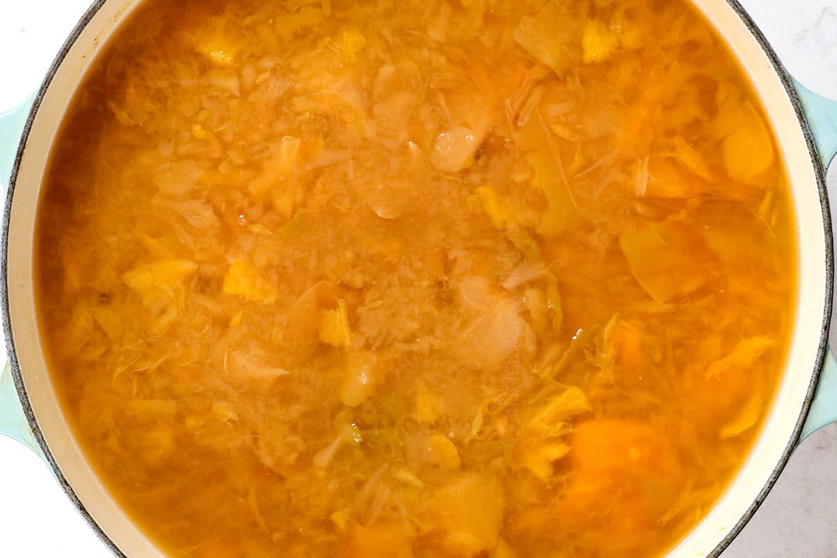 showing how to make apple cider recipe by simmering for one hour after mashing the apples