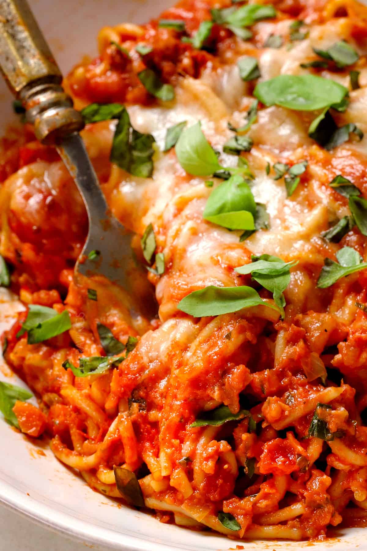 up close of a forkful of baked spaghetti casserole