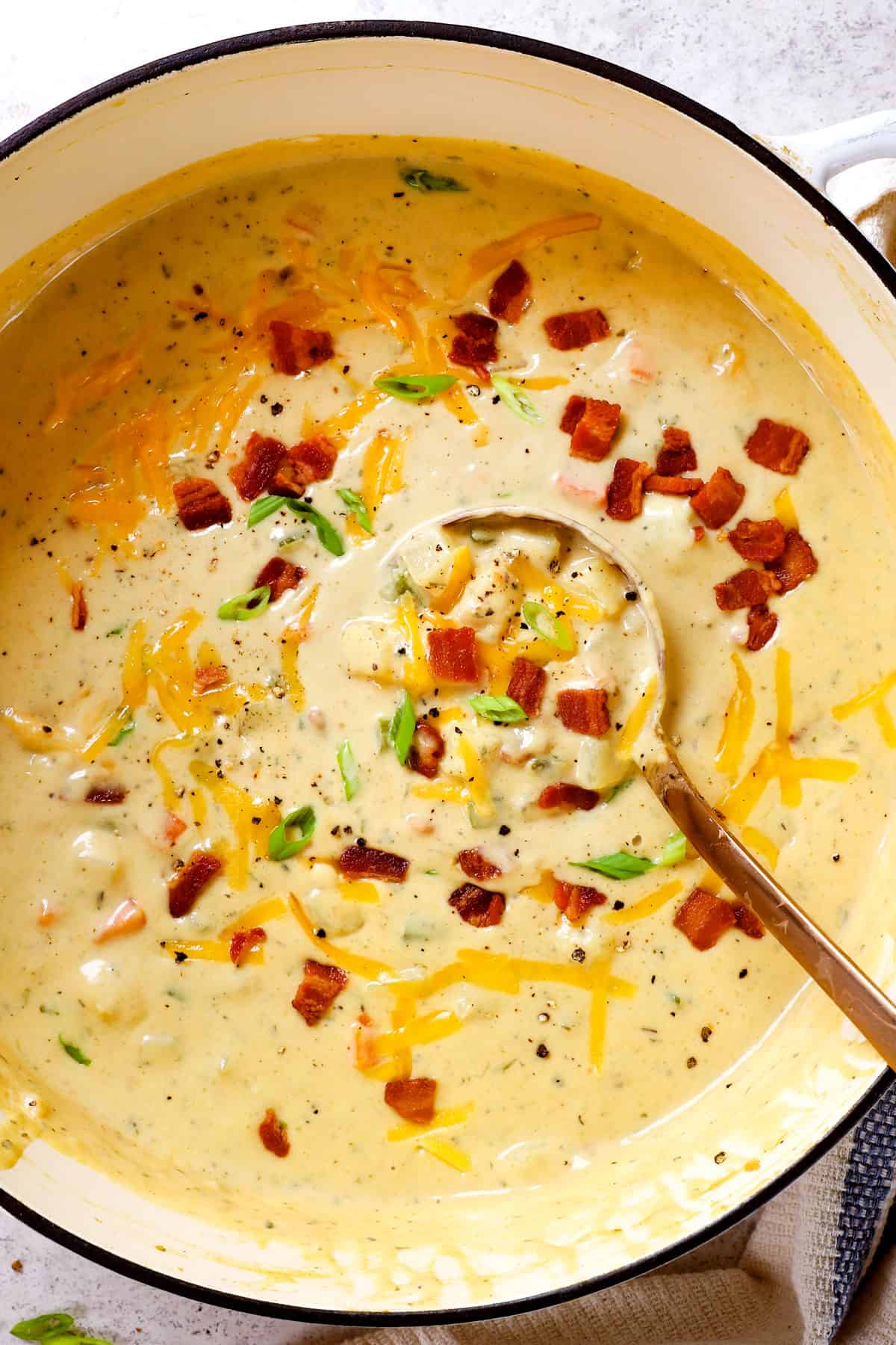 showing how to make potato soup by stirring in pureed soup