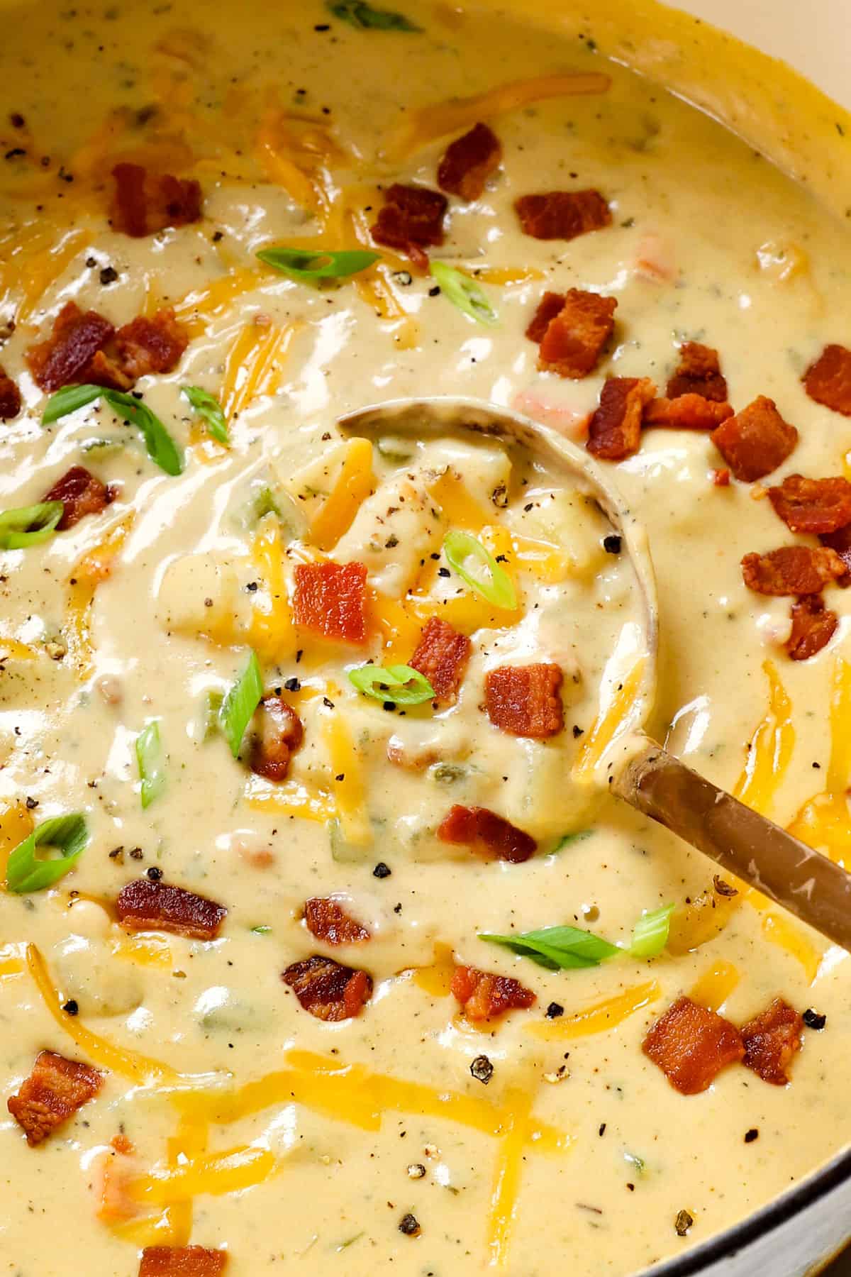 stirring creamy potato soup