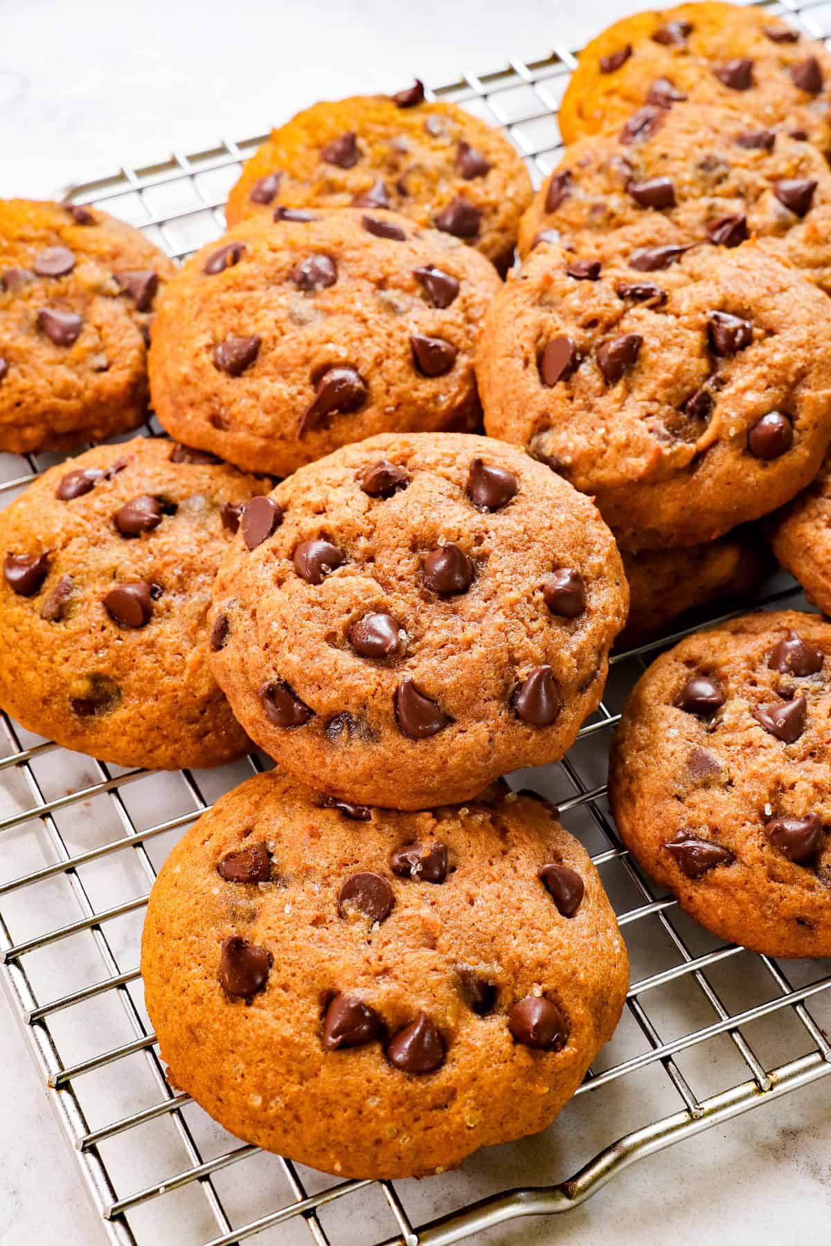 pumpkin chocolate chip cookies recipe on a wire rack